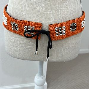 Never worn hand beaded belt from Indonesia adorned with shells.